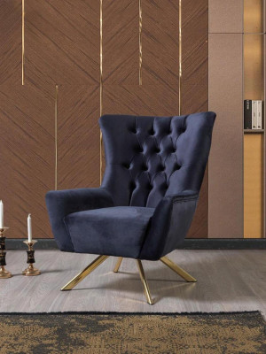 Luxurious blue Chesterfield armchair with velvet upholstery for the living room