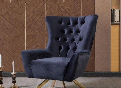 Luxurious blue Chesterfield armchair with velvet upholstery for the living room