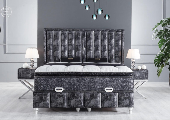 Black bed with mattress and two bedside tables in the bedroom furniture set